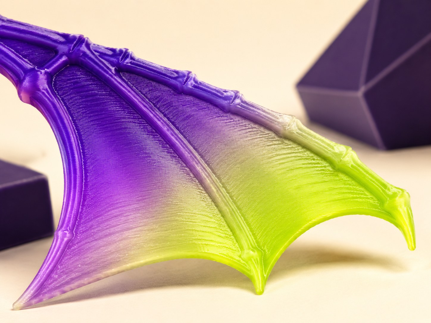 Purple and lime gradient on a printed dragon wing