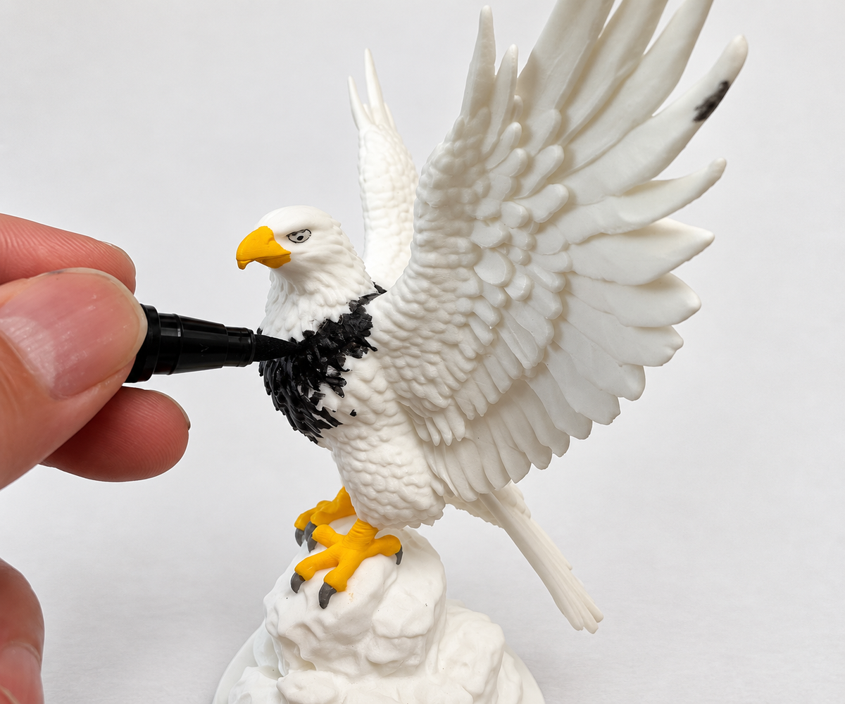 Marker tip adding color to a dragon model